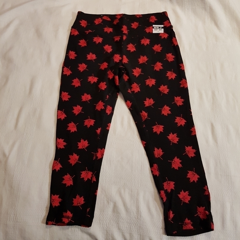 Canada Day women's size medium black leggings with maple leaf design
